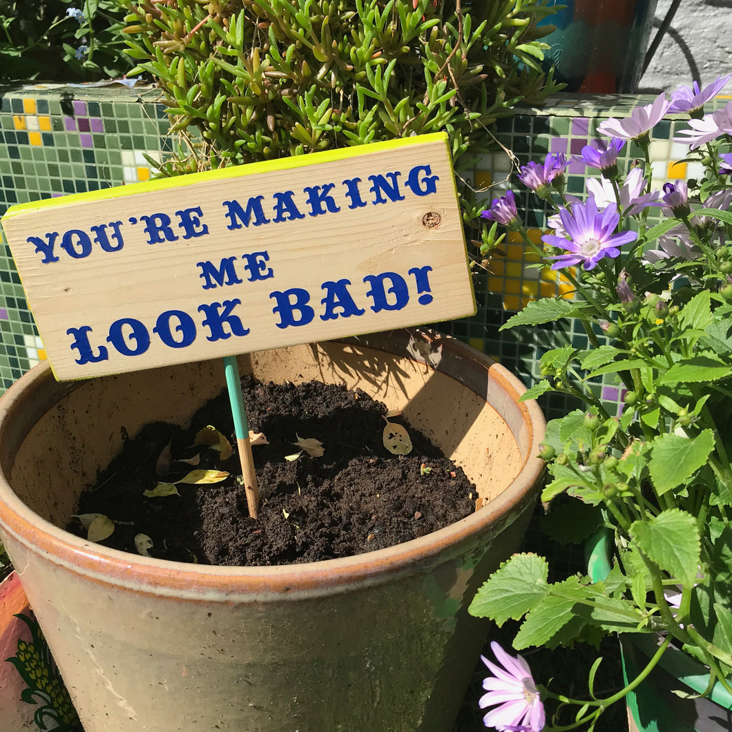 'Your making me look bad' garden sign